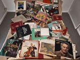 a pile of books on the floor of a room
