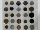 a lot of coins in a plastic case on a table