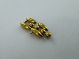 a close up of a pair of brass screws on a white surface