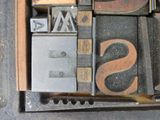 a close up of a type of letterpress with the word sale written on it