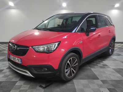 a red opel suv parked in a garage