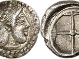 une pièce de monnaie en argent portant l'image d'un visage d'homme