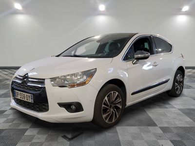 the white citrole is parked on a checkered tile floor