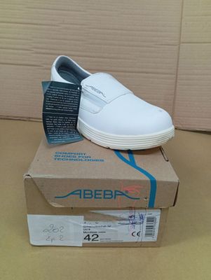 a box with a pair of white shoes on top of it