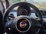 dashboard of a car with a steering wheel and dashboard lights