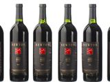 six bottles of red wine are lined up in a row