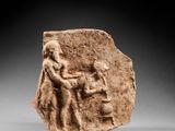 a roman terra relief of a man and a woman