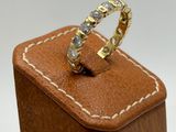 a ring that is sitting on top of a wooden box