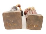 pair of antique bronze figurines of a man and a woman
