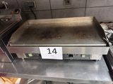a metal counter top with a number 14 on it