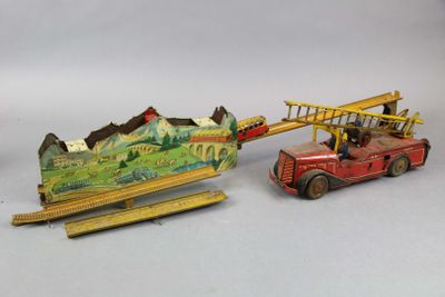 two toy vehicles that are sitting next to each other