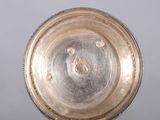 a silver plate that is sitting on a table