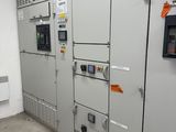 a room with a bunch of electrical equipment in it