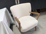 a white chair and a white table in a room