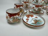 a lot of cups and saucers that are on the table