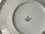 a white plate with a blue and white design on it