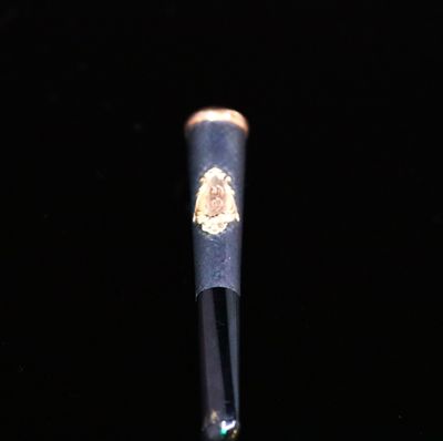 a close up of a baseball bat on a black surface