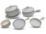 five different types of dishes and spoons on the table
