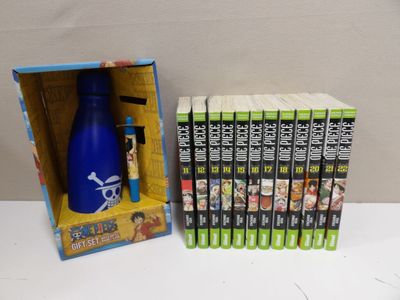 beaucoup de DVD et une bouteille bleue dans une boîte