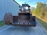 a bulldozer that is parked on the side of the road