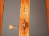 a close up of a door handle on a wooden door
