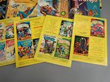 a lot of comic books that are on the table