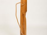 a wooden stick with a rope wrapped around it on a white background