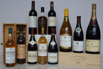 many bottles of wine sitting on a table next to a wooden box