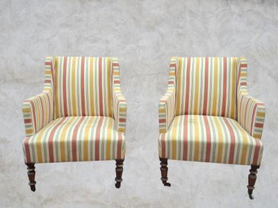 pair of striped upholstered chairs with turned legs