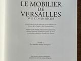 an open book on a wooden table with a black and white cover