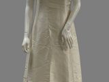 an image of a mannequin wearing a white dress with a beaded neckline