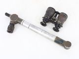 an old pair of binoculars on a white surface