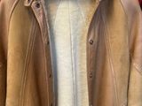 jacket on a hanger on a red wall with a red background