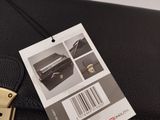 a black briefcase with a price tag attached to it