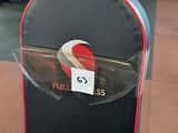 a snowboard that is sitting on a stand in a gym