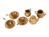 six pieces of brass tea set on a white background