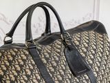a large brown and black duffel bag sitting on a table