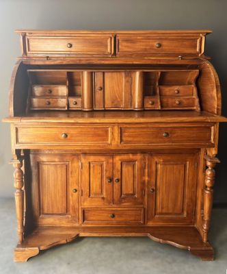 an old wooden dresser with drawers and drawers on it