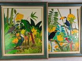 two framed paintings of birds and flowers on a white wall