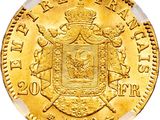 a close up of a gold coin with a coat of arms on it