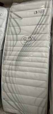 several mattresses are stacked on top of each other in a store