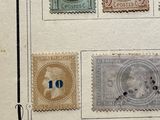 an old picture of a group of stamps on a piece of paper