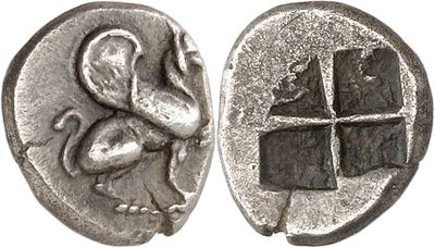 a close up of a silver coin with a bird on it