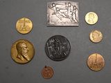 a lot of coins that are on the table
