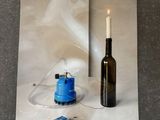 a picture of a candle and a bottle on a piece of paper