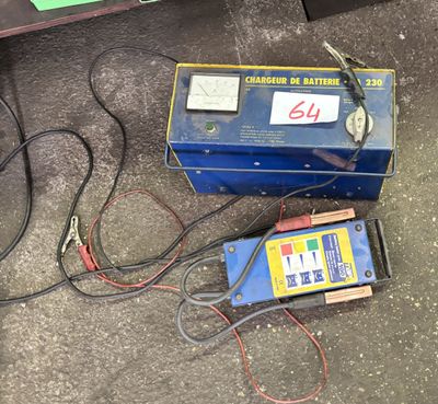 a battery that is sitting on the ground next to a charger