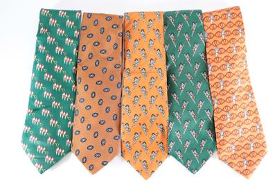 several different colored ties are arranged in a row on a white surface
