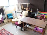 a teddy bear that is sitting on a chair in a room