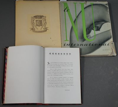 an open book sitting on top of a table next to an open book
