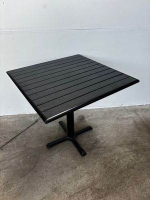 an image of a black square table with a black base